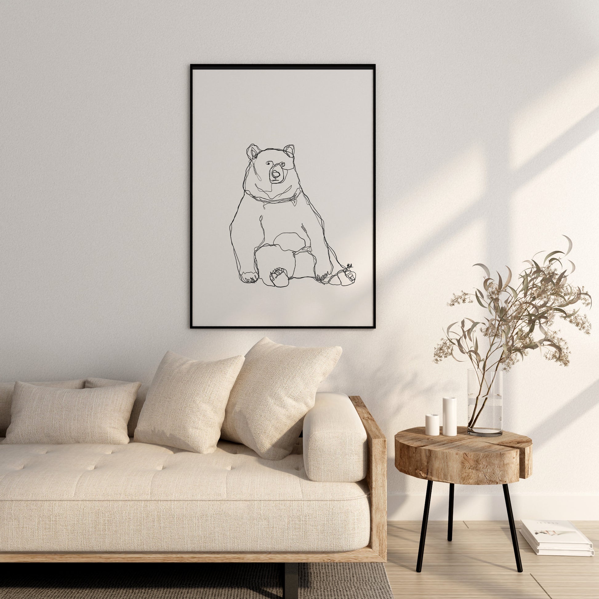 Bear one line drawing print framed in large black print as living room decor